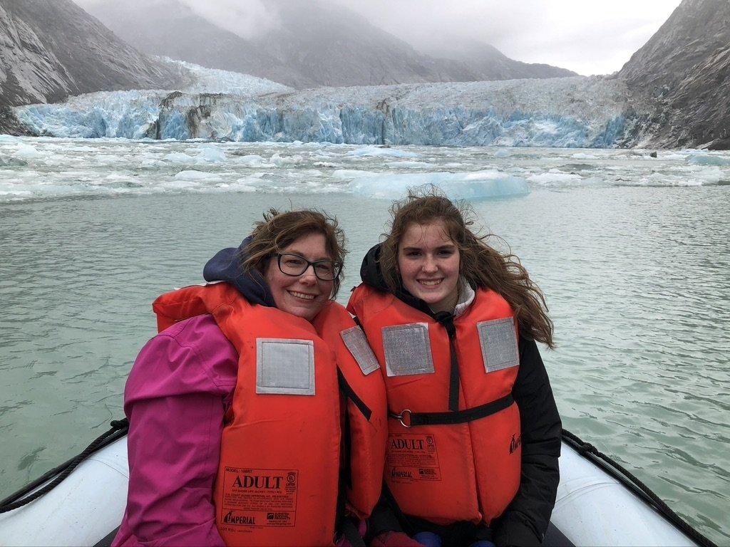 Me and my daughter in life jackets aboard a boat in Alaska