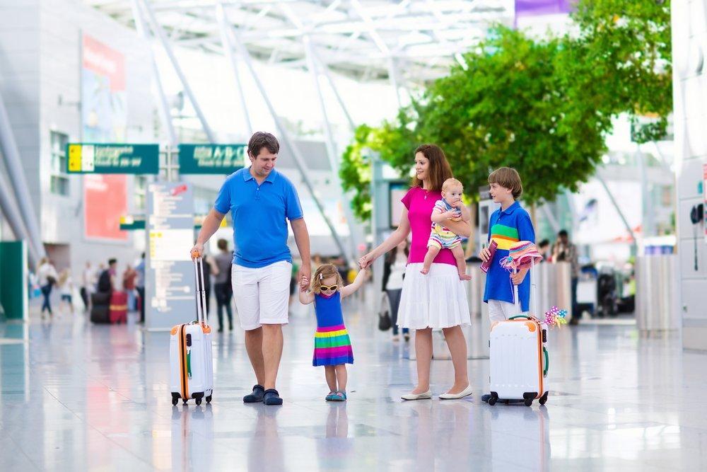 family with young children at the airport