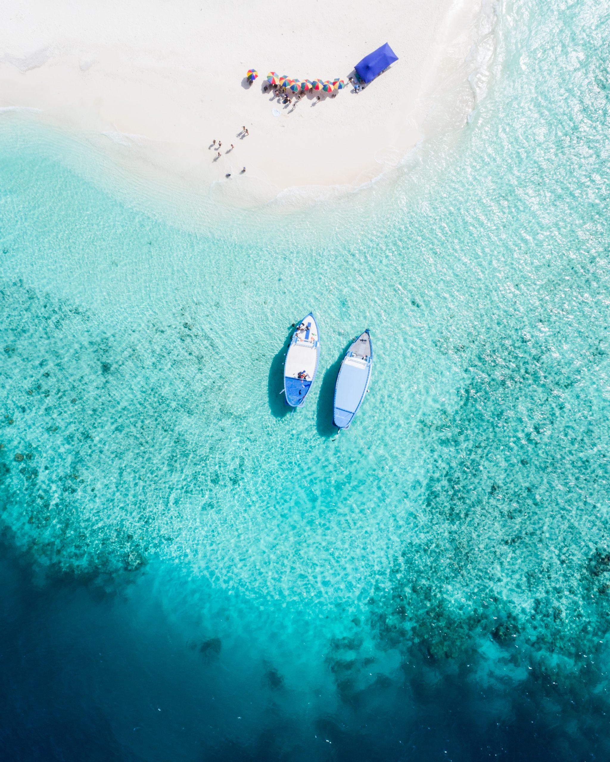 The Beach is Calling for Your Next Family Vacation - two boats in clear blue waters