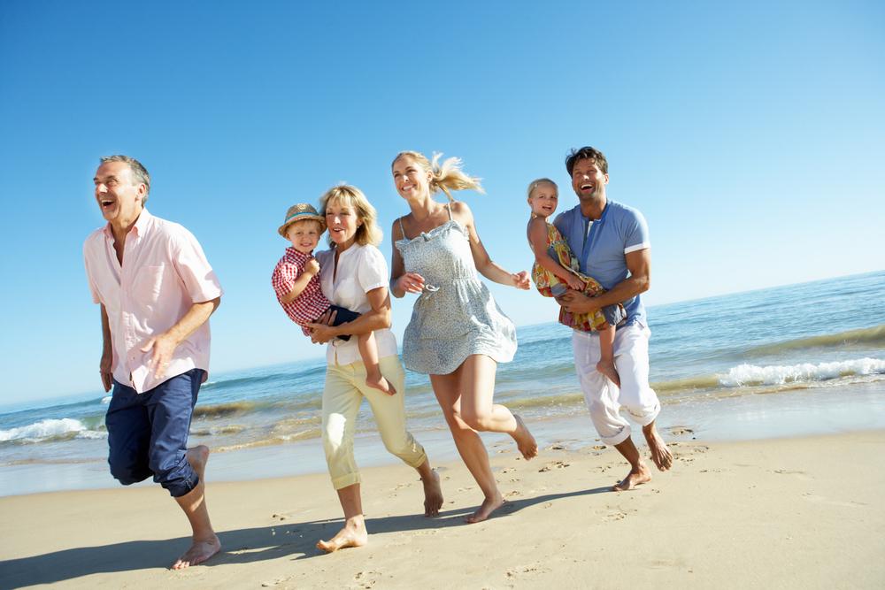 Beach Vacations for Family Friendly Fun in the Sun Activities - Multigenerational Family on a Beach