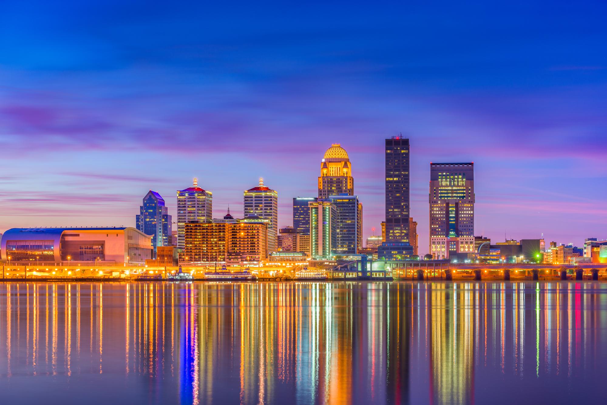 Celebrate the Kentucky Derby During a Family Vacation - Louisville, Kentucky, USA downtown skyline at the river at dusk.