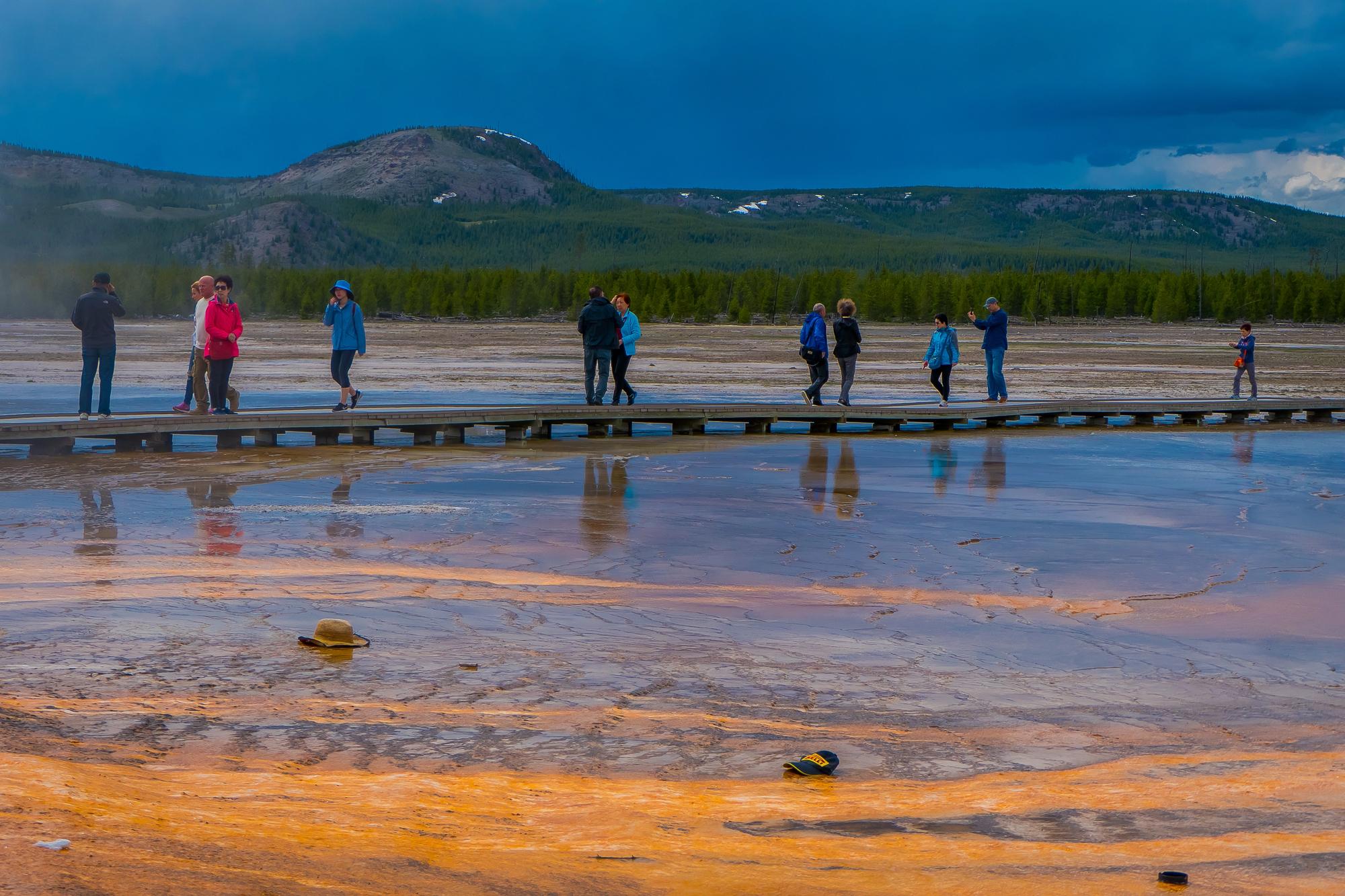 Family Walking Around the Grand Prismatic Spring in Yellowstone National Park